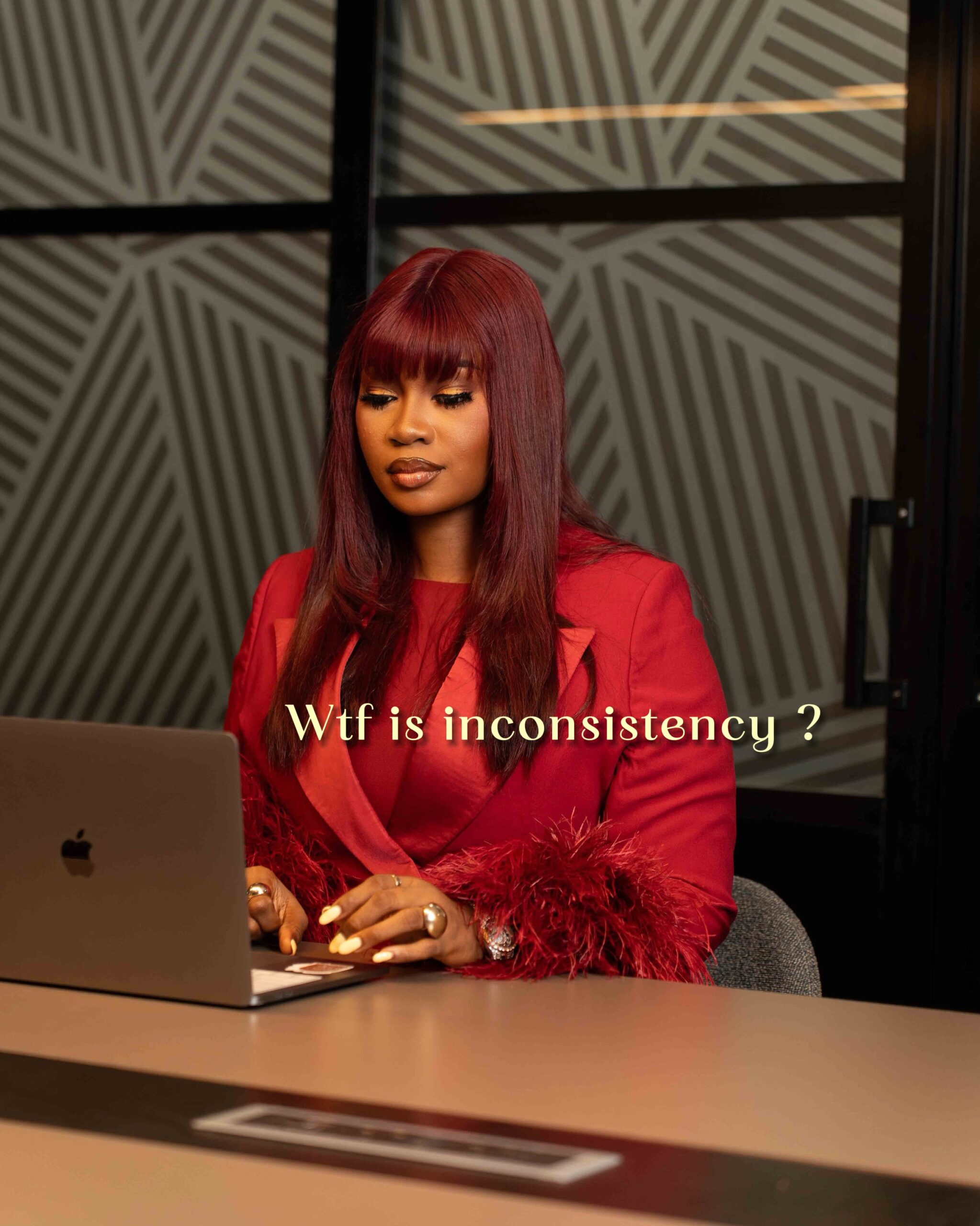 Dr Faith reviewing content on her laptop