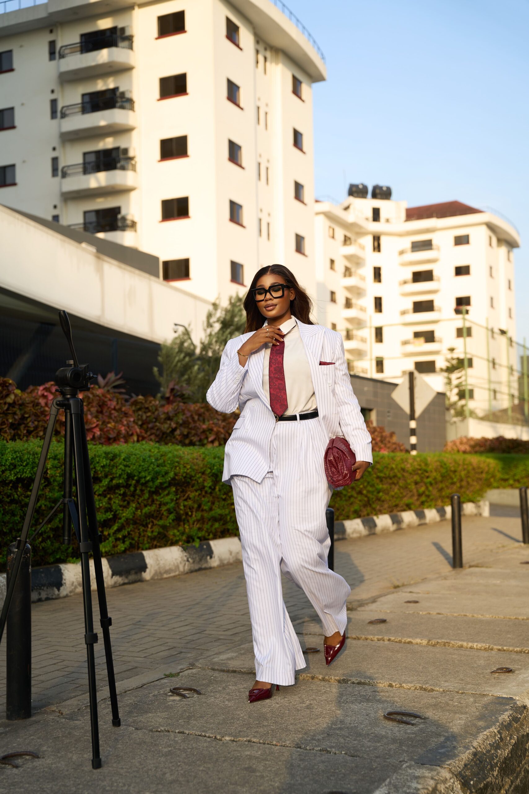 Dr Faith creating content beside a camera